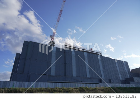 A crane at a construction site and the new building under construction: Taganomori Elementary and Junior High School A crane at a construction site and the new building under construction: Taganomori Elementary and Junior High School 138513182