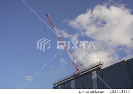 A crane at a construction site and the new building under construction: Taganomori Elementary and Junior High School A crane at a construction site and the new building under construction: Taganomori Elementary and Junior High School 138513183