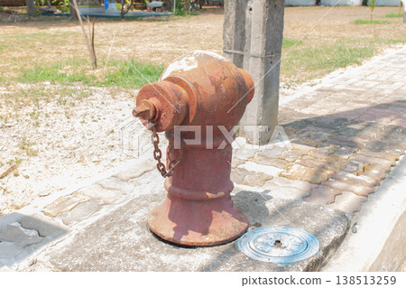 A red outdoor fire hose tank A red outdoor fire hose tank 138513259