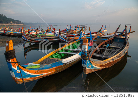 Group of local boat in Taungthaman Lake near U Bein Bridge the longest teak bridge in the world in Amarapura, Myanmar. 138513982