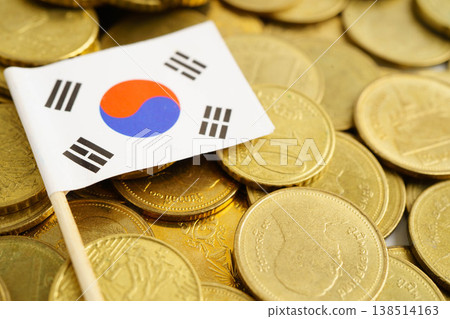 Korea flag on coin and banknote money, finance trading investment business currency concept. Korea flag on coin and banknote money, finance trading investment business currency concept. 138514163