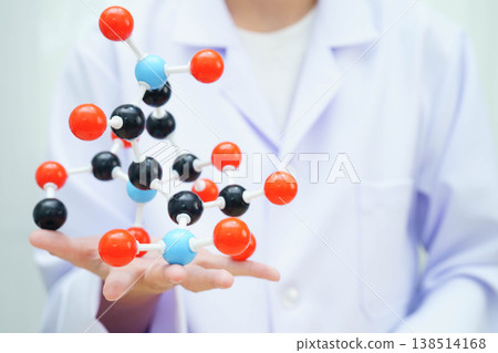 Scientist holding molecular model for chemical technology. Scientist holding molecular model for chemical technology. 138514168