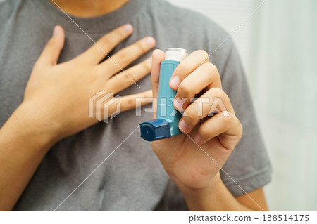 Asthma and chronic obstructive pulmonary disease COPD, Asian teenage using metered dose inhaler MDI. Asthma and chronic obstructive pulmonary disease COPD, Asian teenage using metered dose inhaler MDI. 138514175