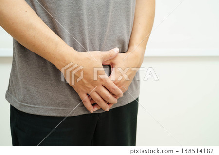 Hernia, Asian man stomach ache, abdominal pain and urology problem health. 138514182