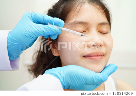 Asian woman receiving filler beauty injection. Asian woman receiving filler beauty injection. 138514209