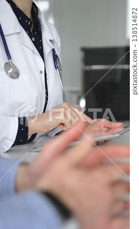 Experienced female doctor consulting patient man, providing medical advice and writing prescription during hospital appointment. Medicine, healthcare and science concept 138514872