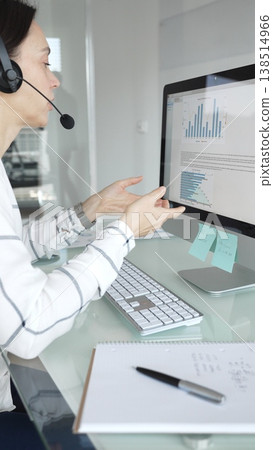 Woman working in call center, providing customer support through headset, communicating in virtual office meeting. Business people concept Woman working in call center, providing customer support through headset, communicating in virtual office meeting. Business people concept 138514966