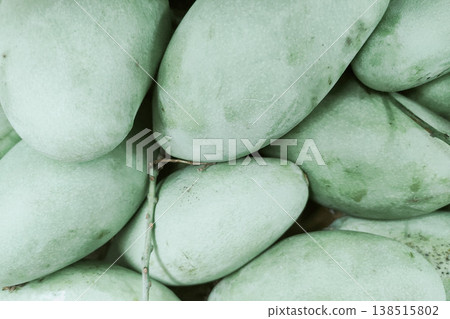 Fresh Green Mango Pile Close-Up for Culinary Ingredient Use Fresh Green Mango Pile Close-Up for Culinary Ingredient Use 138515802