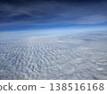 Beautiful landscape aerial shot of endless white stratocumulus clouds blanketed beneath the earth's blue atmosphere during a flight to Andaman. 138516168
