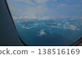 Airplane window view overlooking the spectacular turquoise waters and lush green tropical islands of the Andaman and Nicobar archipelago. 138516169