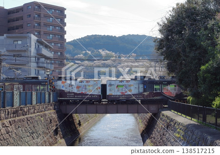 Lake Biwa Canal, the cherry blossoms in full bloom at Mii-dera Temple, and the Keihan Railway. 138517215