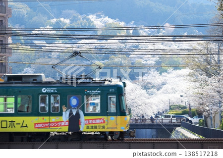 Lake Biwa Canal, the cherry blossoms in full bloom at Mii-dera Temple, and the Keihan Railway. Lake Biwa Canal, the cherry blossoms in full bloom at Mii-dera Temple, and the Keihan Railway. 138517218