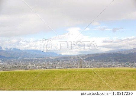 Ancient burial mounds and townscape Ancient burial mounds and townscape 138517220