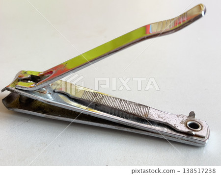 Old Rusty Metal Nail Clipper On White Background Close-up Old Rusty Metal Nail Clipper On White Background Close-up 138517238