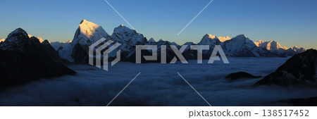 High mountains Cholatse, Kantega, Thamserku and Kusum Kanguru at sunset seen from Gokyo Ri, Nepal. 138517452