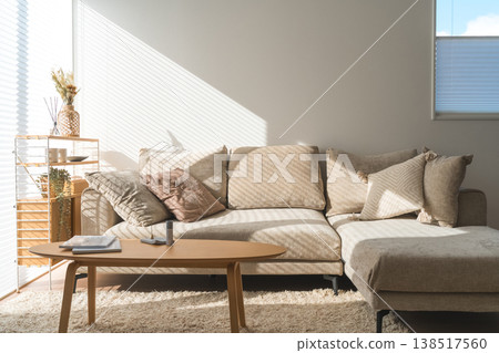 Sunny living room with sofa and table 138517560