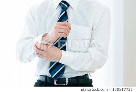 Hands of a businessman getting ready to go to work 138517722