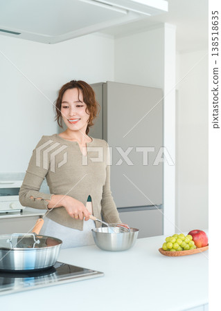 Making breakfast in the kitchen, Woman preparing breakfast Making breakfast in the kitchen, Woman preparing breakfast 138518635