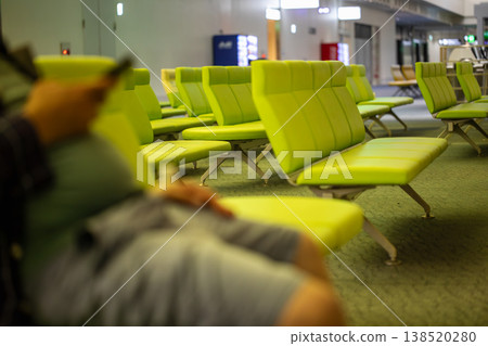 Bright green seats in the airport waiting room Bright green seats in the airport waiting room 138520280