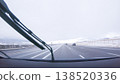 The open highway invites a peaceful drive, with snow-clad pines lining I-25 as the journey continues from Denver towards Colorado Springs on a snowy day. 138520336