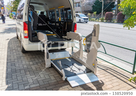 A welfare vehicle with an open wheelchair access hatch. A welfare vehicle with an open wheelchair access hatch. 138520950