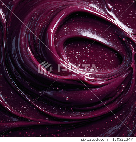 Glossy deep rich maroon fluid swirl in abstract style on dark backdrop, symbolizing creativity and motion and dynamic energy 138521347