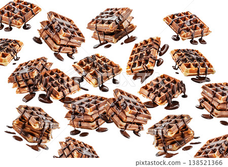 Crispy waffles generously drizzled with rich chocolate syrup, on white background. Concept of dessert, indulgence, sweetness 138521366