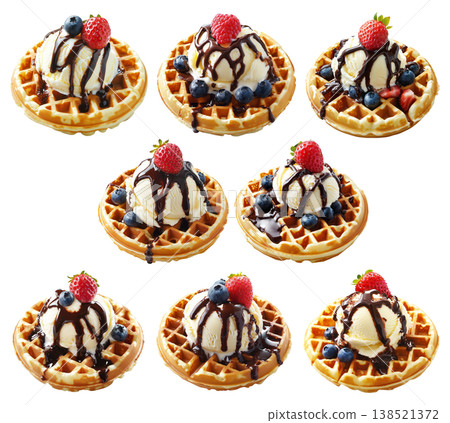 Waffle topped with vanilla ice cream, chocolate syrup, raspberry, and blueberries isolated on white background 138521372