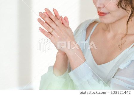 Japanese woman applying hand cream (skincare) Japanese woman applying hand cream (skincare) 138521442