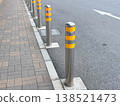Bollards (passenger barriers) that separate sidewalks from roadways. 138521473