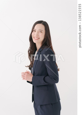 Upper body portrait of a young woman in a suit 138521555