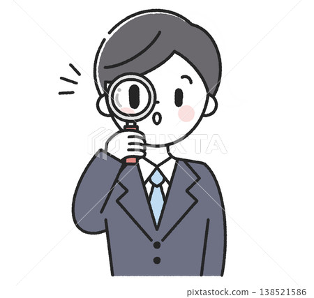 A male employee looking through a magnifying glass 138521586