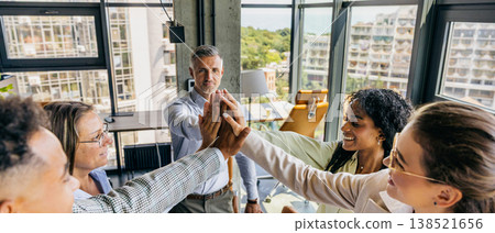 Varied professionals rejoice with uplifted hands and smiling faces Varied professionals rejoice with uplifted hands and smiling faces 138521656