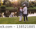 Happy Multigenerational family with mother, father, children and grandmother walking, playing and spending time together in beautiful summer park nature, active lifestyle, outdoors 138521885