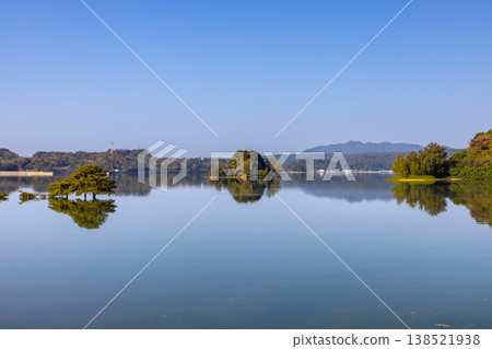 Makiya, Nago City, Okinawa Prefecture: The Haneji Inland Sea, surrounded by Okinawa Island and Yagaji Island; the scenery of the opposite shore reflected on the water's surface. Makiya, Nago City, Okinawa Prefecture: The Haneji Inland Sea, surrounded by Okinawa Island and Yagaji Island; the scenery of the opposite shore reflected on the water's surface. 138521938