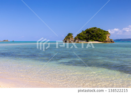 The milky blue sea scenery, including a turtle-shaped islet off the coast of Yagaji Beach on Yagaji Island in Yaga, Nago City, Okinawa Prefecture. 138522215
