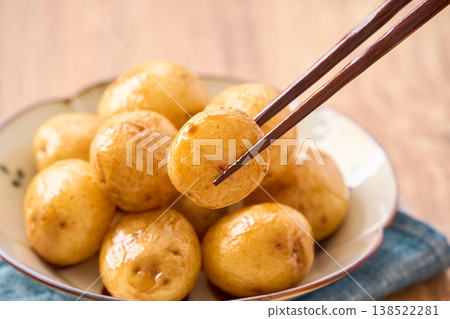 Simmered new potatoes: A spring side dish of potatoes simmered in a sweet and savory sauce with the skin on. Simmered new potatoes: A spring side dish of potatoes simmered in a sweet and savory sauce with the skin on. 138522281