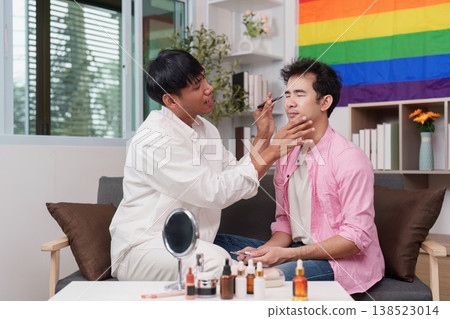 Men enjoying makeup session in a pride-themed room Men enjoying makeup session in a pride-themed room 138523014
