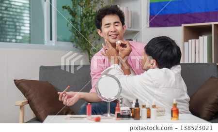 Couple applying makeup together in a cozy setting Couple applying makeup together in a cozy setting 138523021