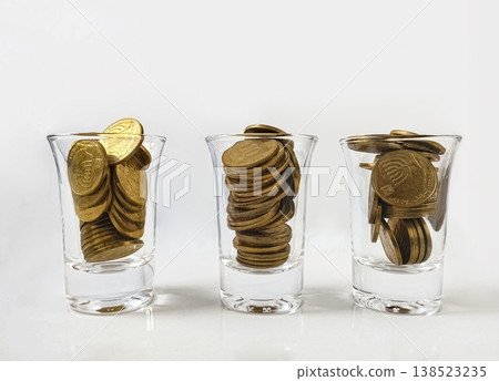 Coins in glass stacks for vodka. Coins in glass stacks for vodka. 138523235