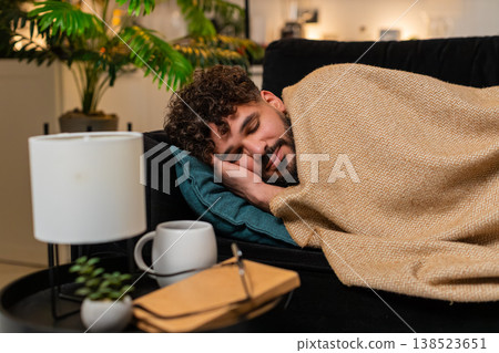 Arabian man exhausted after hard workday lies on pillow closes eyes falls asleep stressed tired late 138523651