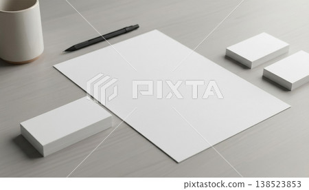 Multiple surfaces with blank paper business cards pen and coffee cup on a light grey table Multiple surfaces with blank paper business cards pen and coffee cup on a light grey table 138523853