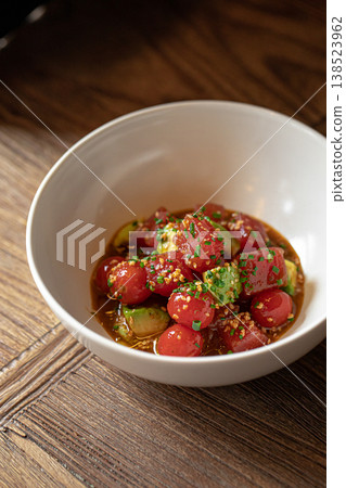 Cherry tomatoes in kimchi sauce with herbs 138523962