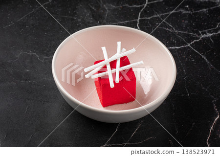 Elegant red mousse dessert with white garnish 138523971