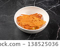 Crispy tuile dessert with cream in bowl 138525036