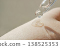 Skincare serum dropping on skin, providing hydration and essential care for beauty 138525353