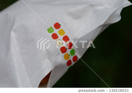 Apple croissant wrapped in a bag 138526031