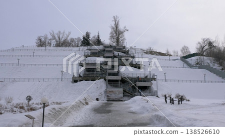 March 22 2026 Barnaul Russia staircase to observation deck of Nagorny Park covered in snow cold early spring urban park cityscape and winter atmosphere. 138526610