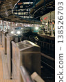 A Shinkansen bullet train arriving at its final destination station at night. 138526703