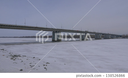 March 22 2026 Barnaul Russia new bridge over Ob River connecting Central District and right bank covered in snow cold early spring cityscape urban infrastructure and winter atmosphere. 138526866